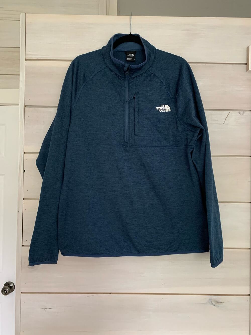 The North Face men’s long sleeve blue half zip size Large 
EEUC